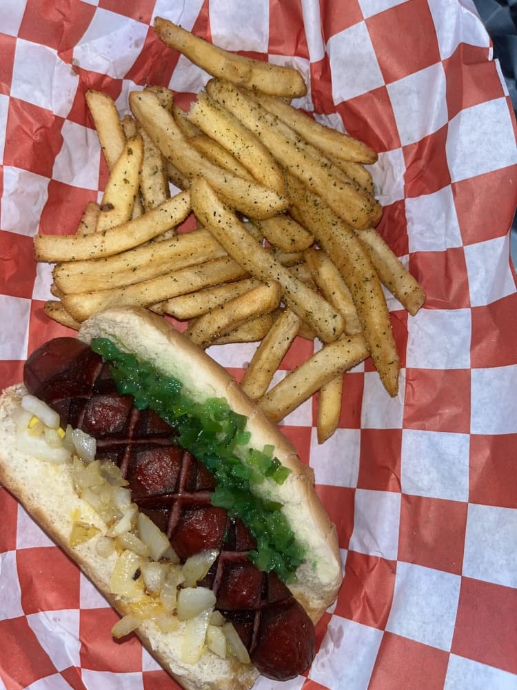 Fried Polish ($3.99) is served with a side of fries and a soda. (Peyton MacKenzie/Community Impact)