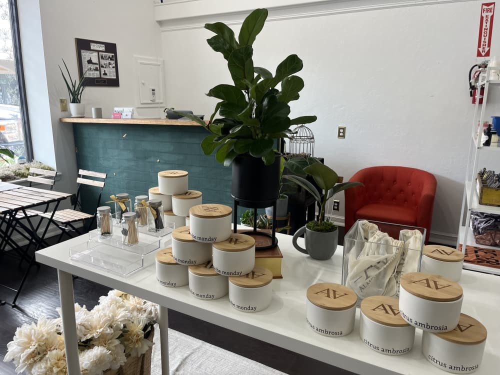 The picture shows a wide view of the business with candles on a table