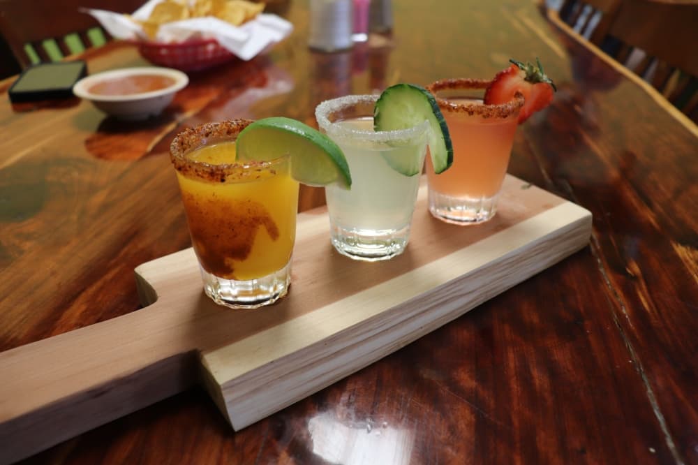 A new addition to the menu is this vodka shot flight with different flavors. (Zara Flores/Community Impact)
