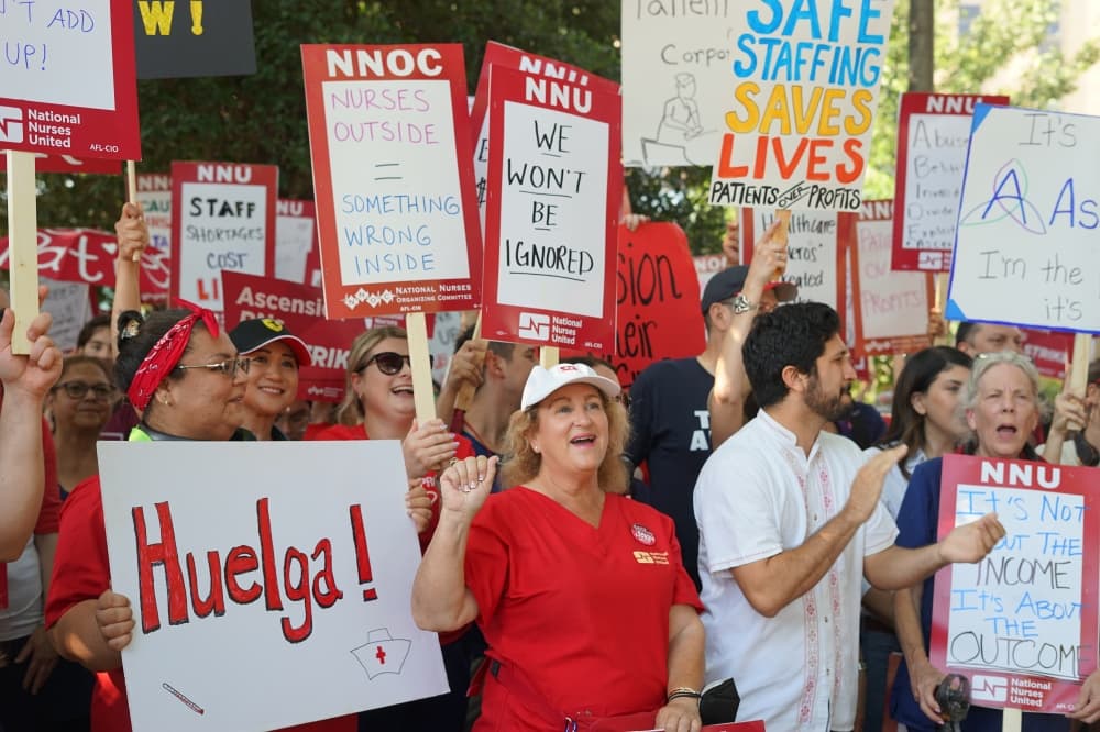 Nurses protesting with signs