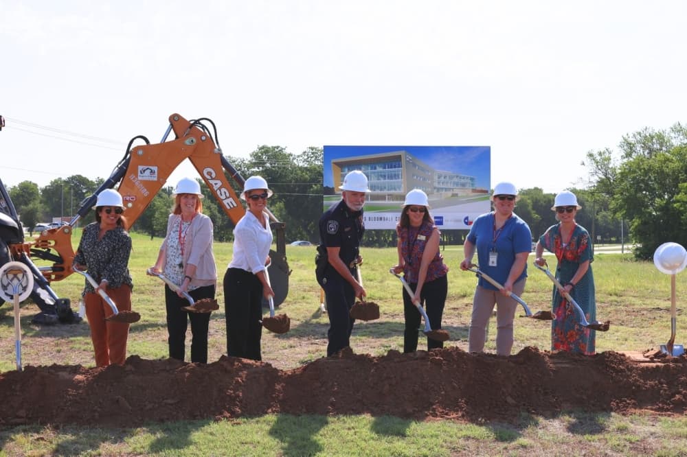 Members of LifePath Systems' board shoveling dirt at the groundbreaking
