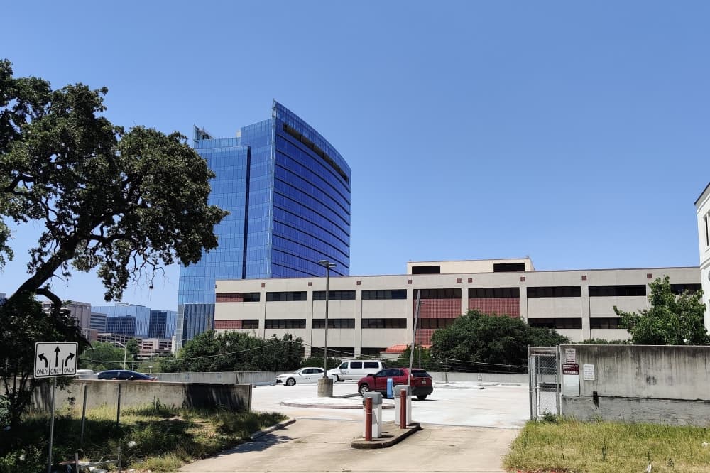 exterior of parking garage and vacant health care facility 