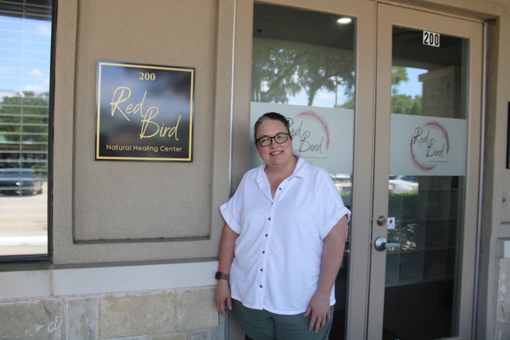Dr. Sherian McCoy in front of Red Bird Natural Healing