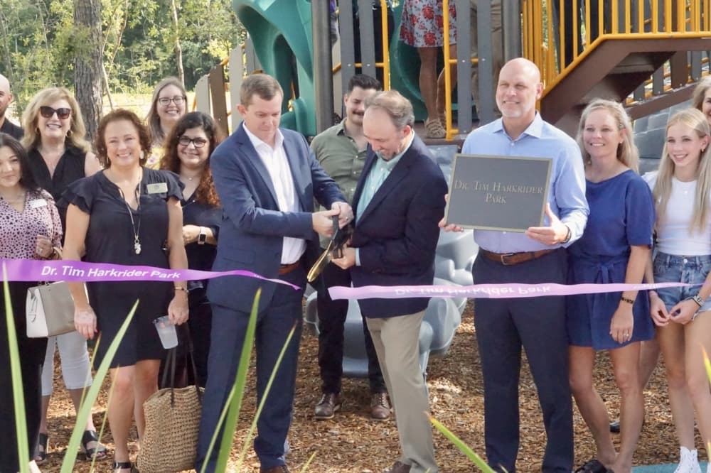 Representatives of the Howard Hughes Corp. cut the ribbon at the new Harkrider Park. (Cassandra Jenkins/Community Impact)