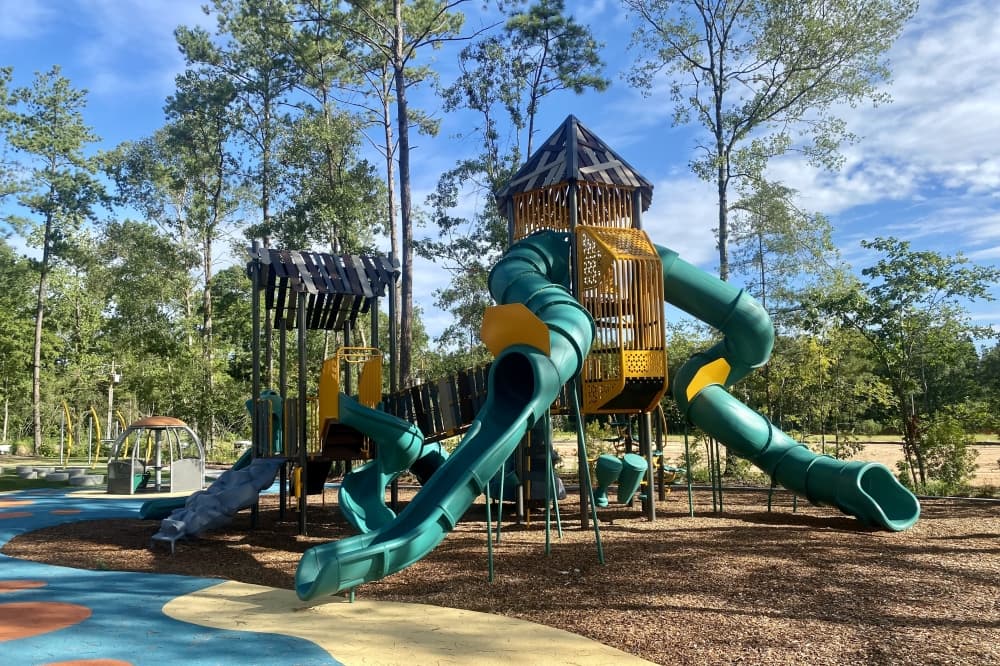 Harkrider Park is a 1-acre park with a playground, swings and slides in The Woodlands Hills. (Cassandra Jenkins/Community Impact)
