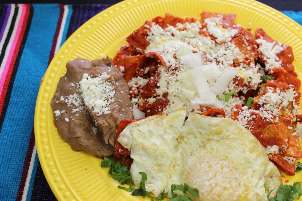 chilaquiles on a yellow plate