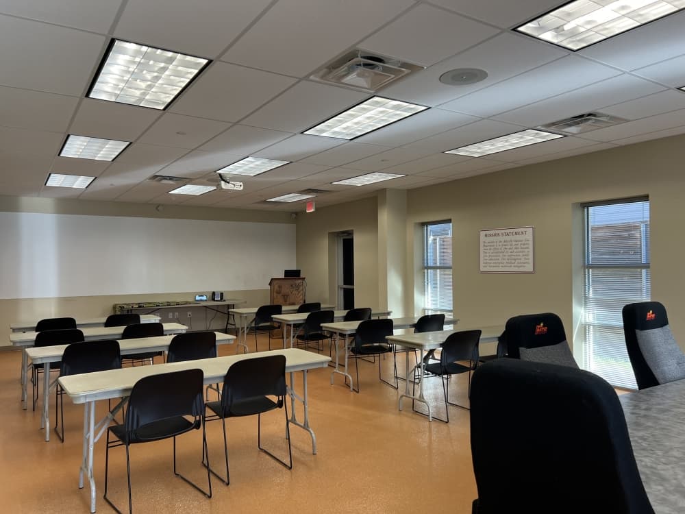 classroom with brown floors and tan walls