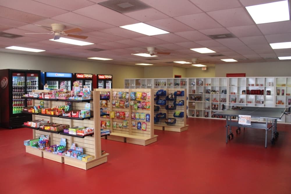 Break Stop shelving with snacks and candy.