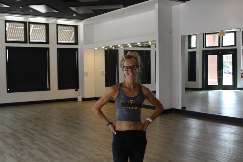 Picture of a woman standing in a yoga studio