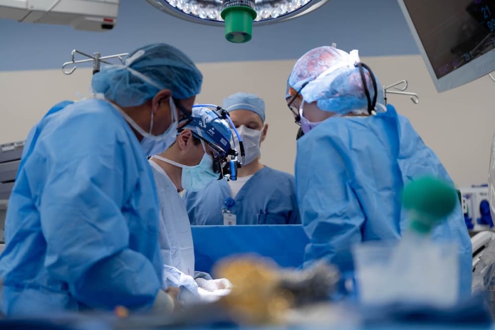 Surgeons performing a partial heart transplant.