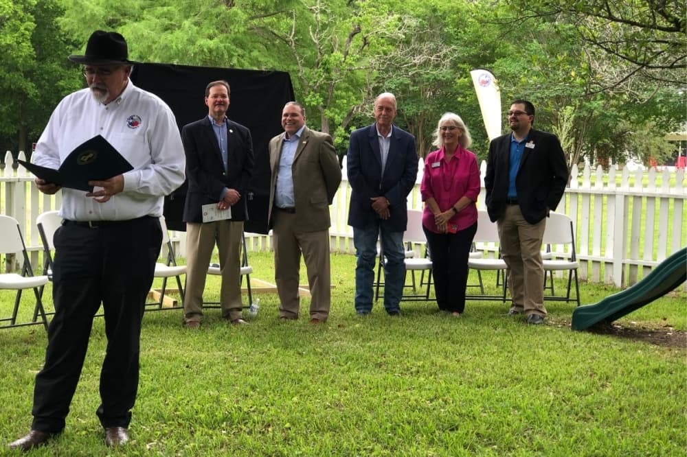 Former Harris County commissioner, former Katy mayor, Katy ISD superintendent, Katy council members and Katy City Administrator stand together at ribbon cutting of 3B Learning Center in Katy. 