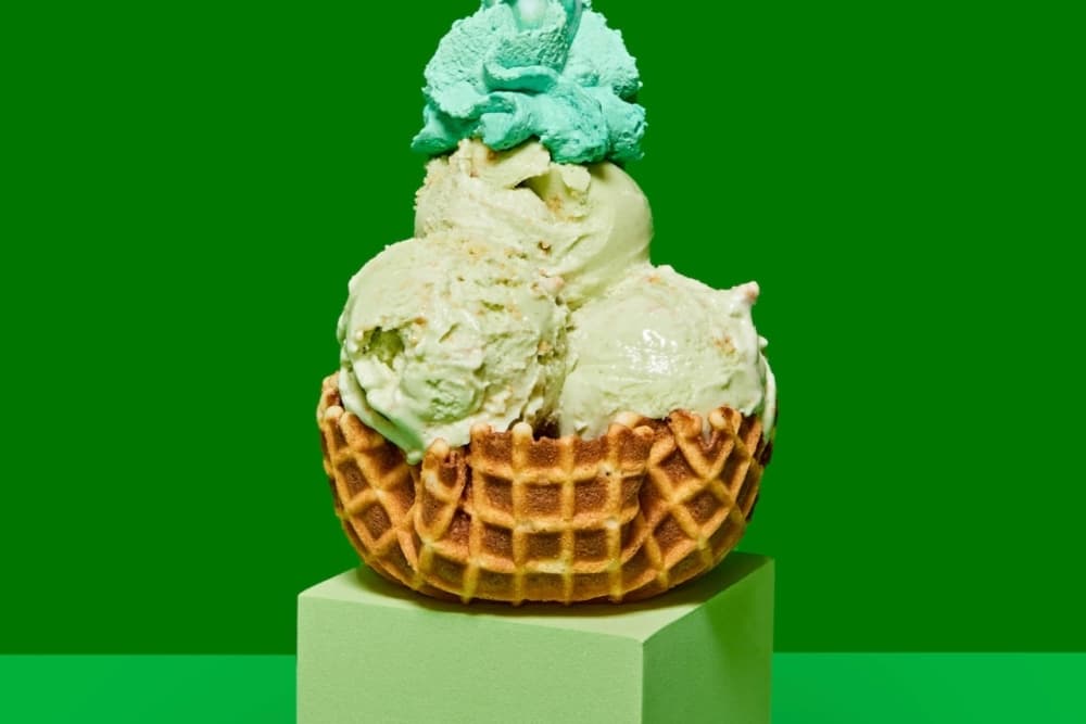 This is a photo of ice cream in a waffle bowl.