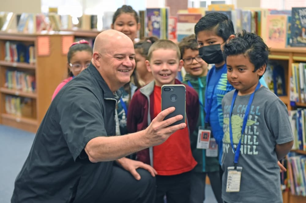 Henry takes a selfie with students in 2022. (Courtesy Cy-Fair ISD)