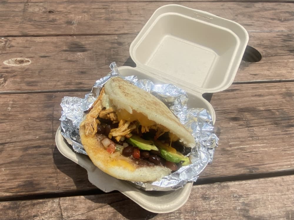 cornmeal sandwich with meat, cheese, bean and avocado filling 