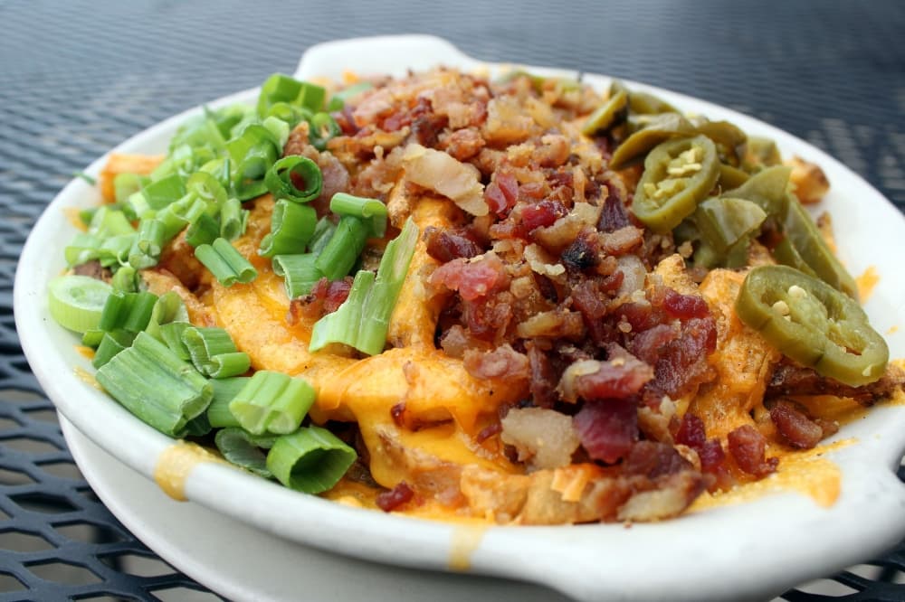 a close up of cheese fries