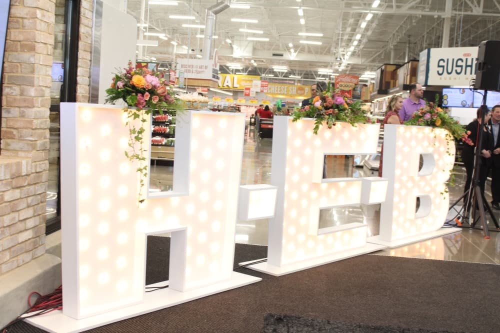 H-E-B white light-up signs at the event