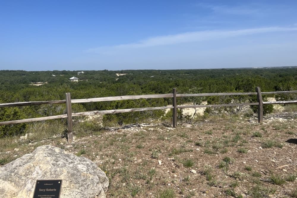 overlook area with short fence made of sticks of wood