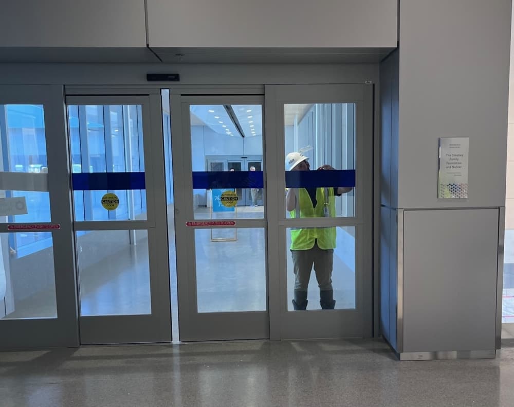 A construction worker focuses on final finishes of the new University Health Women's and Children's Hospital before it opens in August. (Tricia Schwennesen/Community Impact)