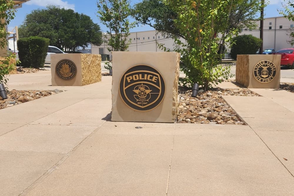 Stones in the Heroes Memorial with insignias