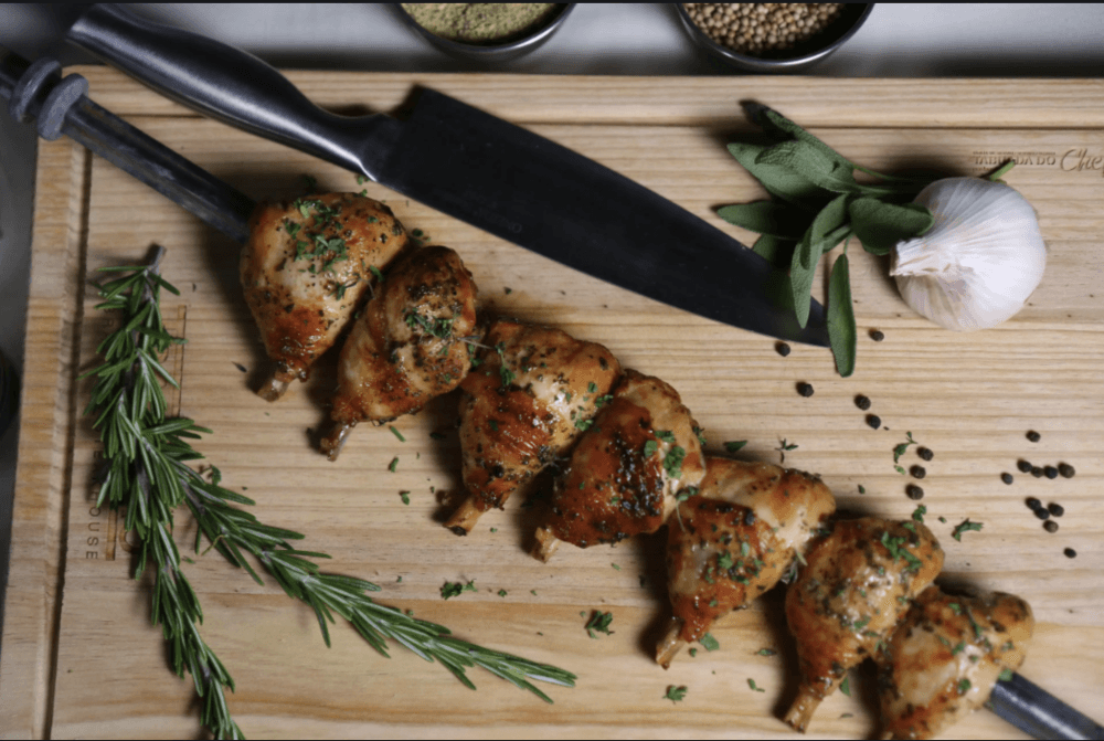 Chicken drumsticks on a skewer. (Courtesy Avenida Brazil)