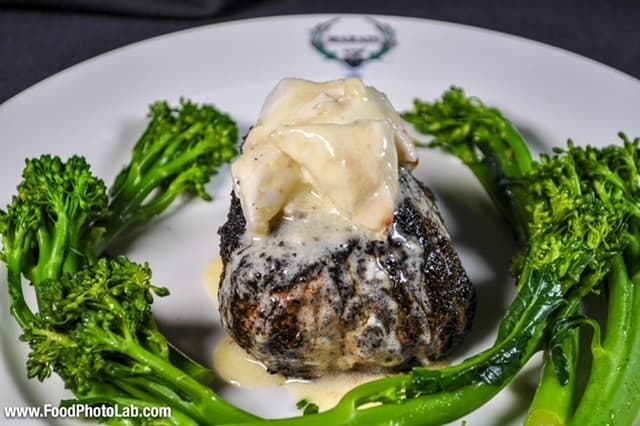 Marais Filet - A steak that is a prime 8-ounce beef tenderloin that is coffee crusted and blackened. It's topped with lump crab, sautéed broccolini and truffle butter. (Courtesy Marais)