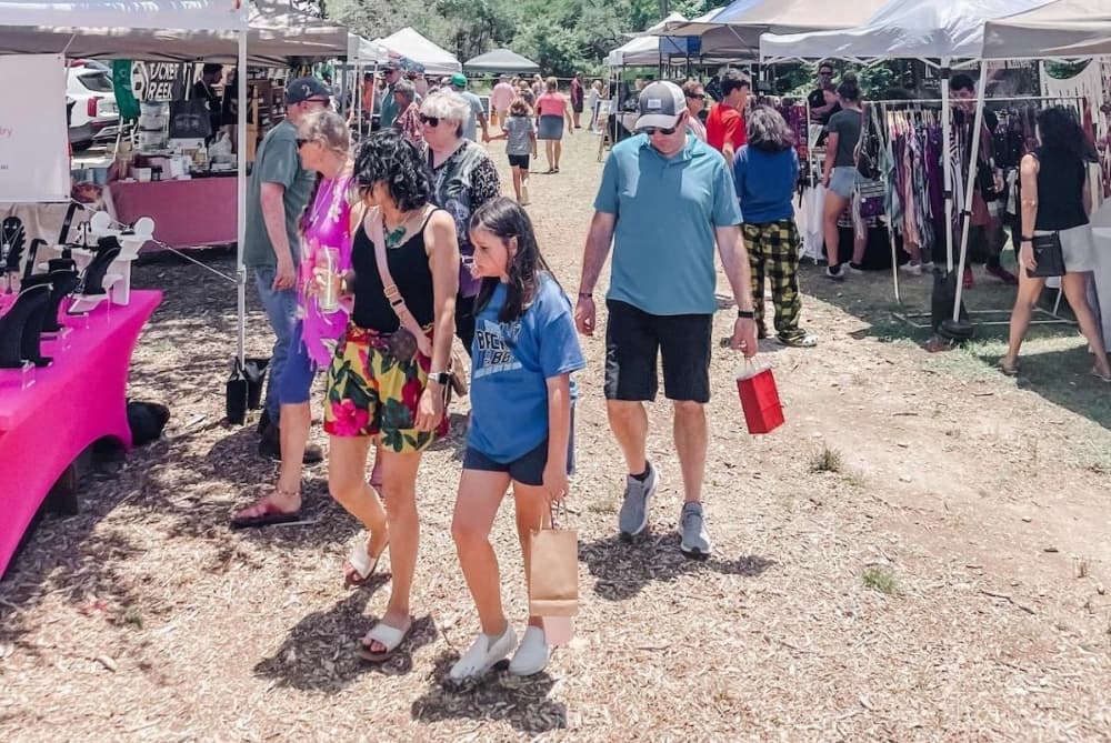 Families peruse the vendors outside at a previous festival.