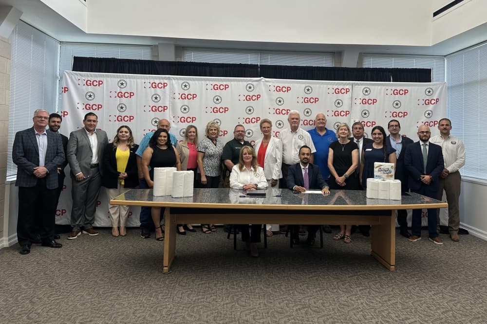 A group photo of officials at the signing ceremony