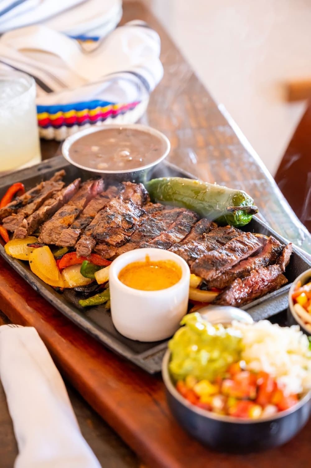 steak fajita spread with salsas. 
