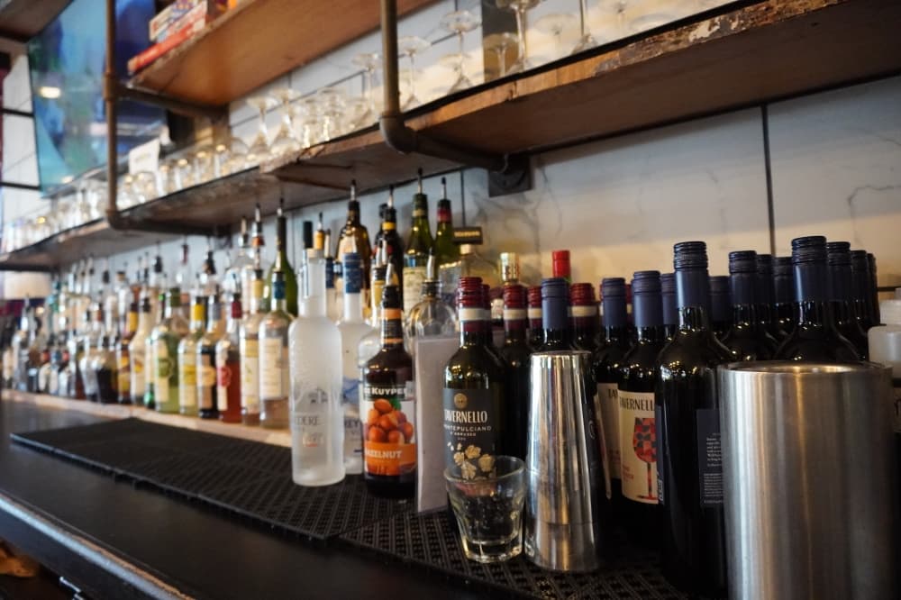 bar with various drinks and glasses