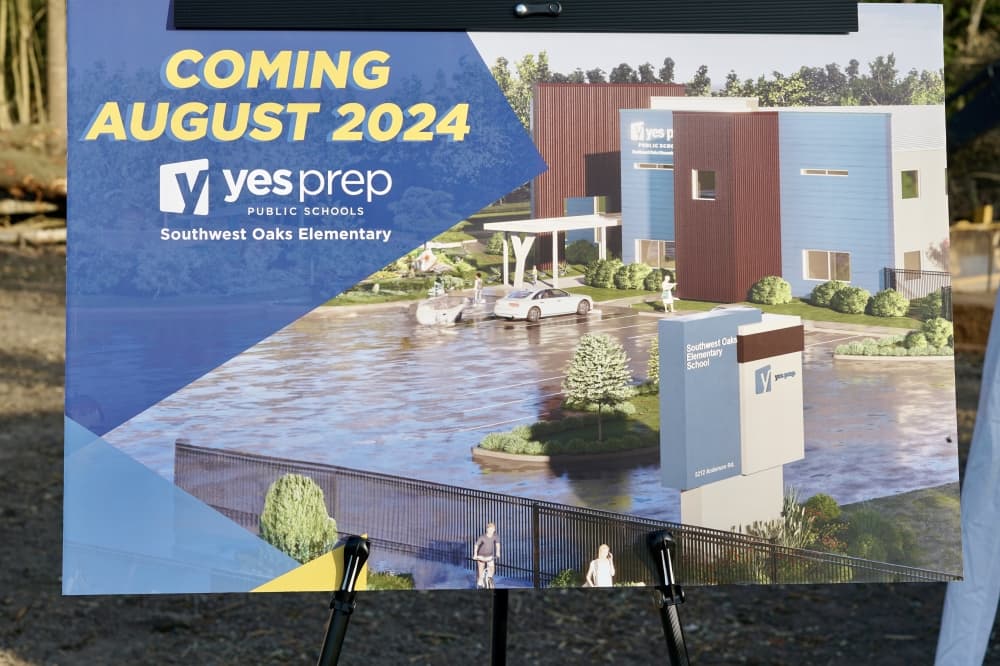 Coming soon construction sign with depiction of new school