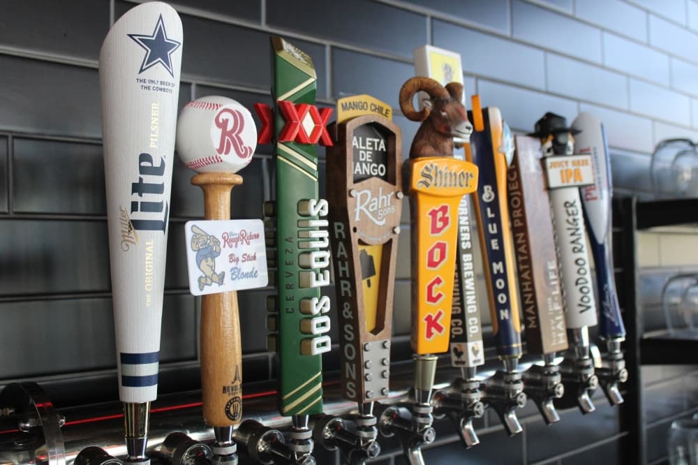 Bar tap with several draft beers.
