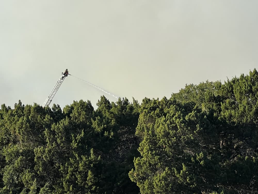 Local emergency responders are continuing to work toward completely containing the fire with assistance from the Texas A&M Forest Service. (Grace Dickens/Community Impact)