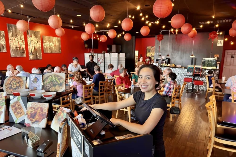 A photo of Ashley working in the interior of the restaurant 
