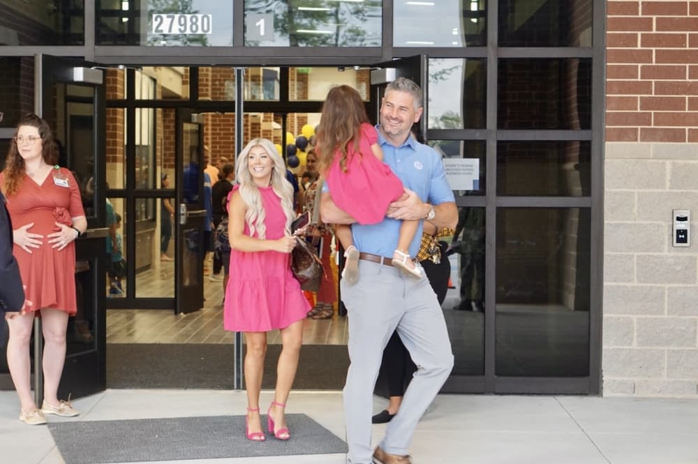 Parents and children celebrate the opening of Hines Elementary School on the first day of school. (Cassandra Jenkins/Community Impact)