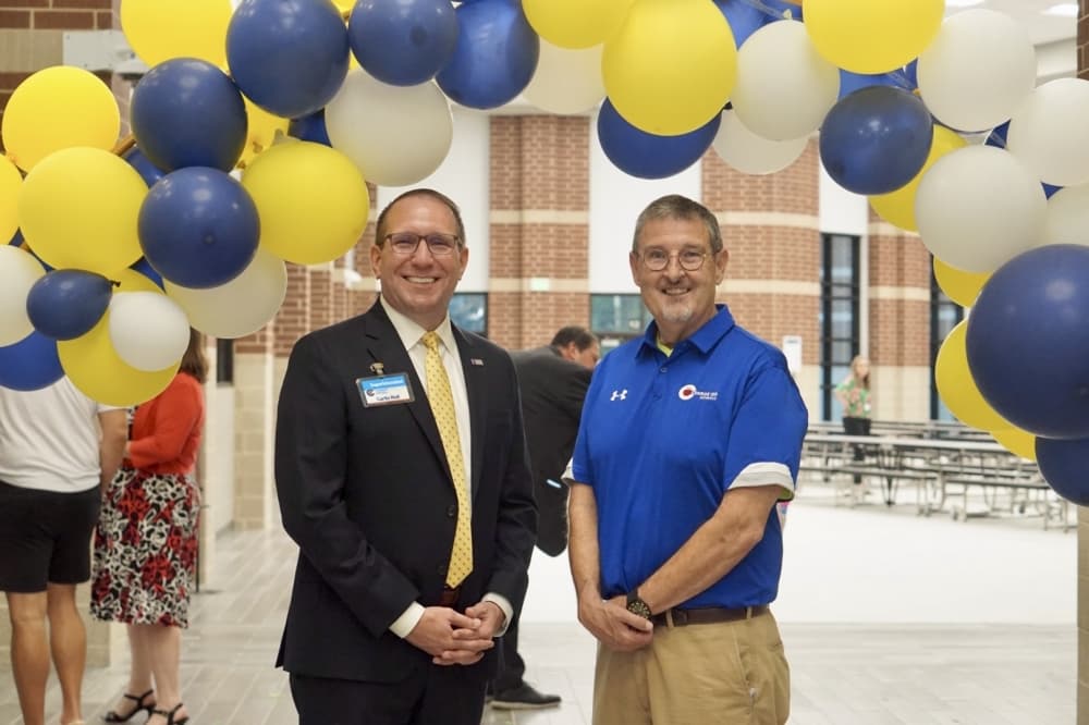 Conroe ISD Superintendent Curtis Null (left) and retired Deputy Superintendent Christopher Hines celebrate the new Hines Elementary. (Cassandra Jenkins/Community Impact)