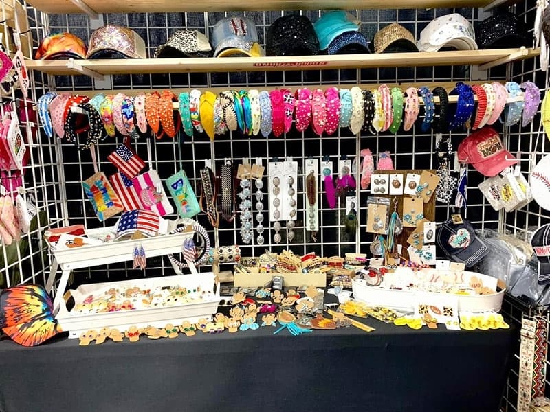 a craft booth with hats and crafts