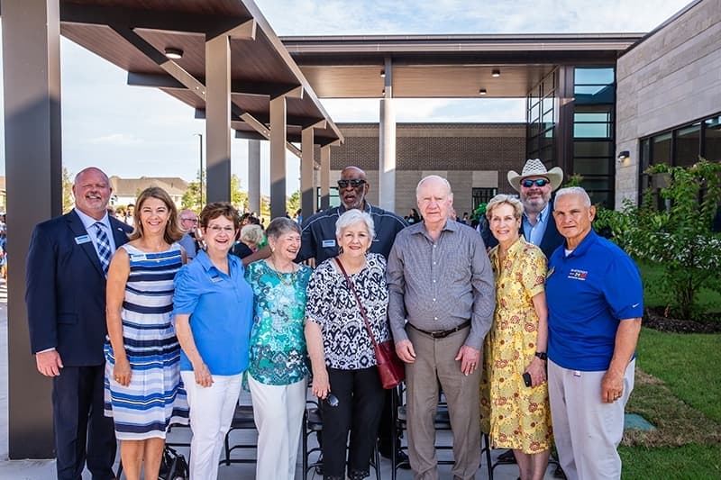 District leaders, board members and the Frazier family
