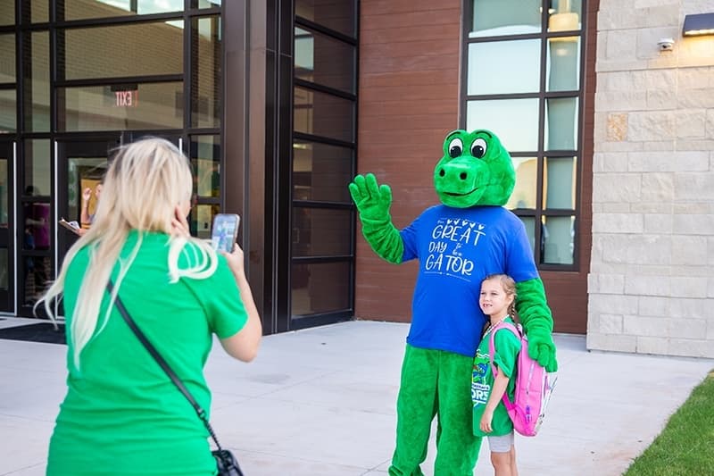 Student with a gator mascot