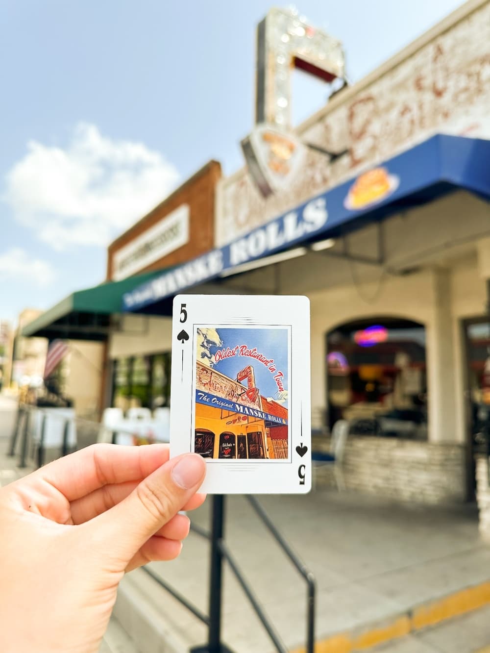 one card being held up