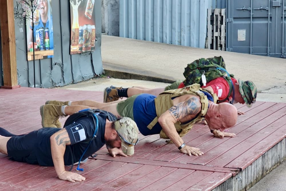 MAD for vets previous year attendees doing pushups 