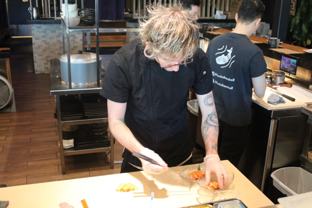 Paul Goar prepares sushi
