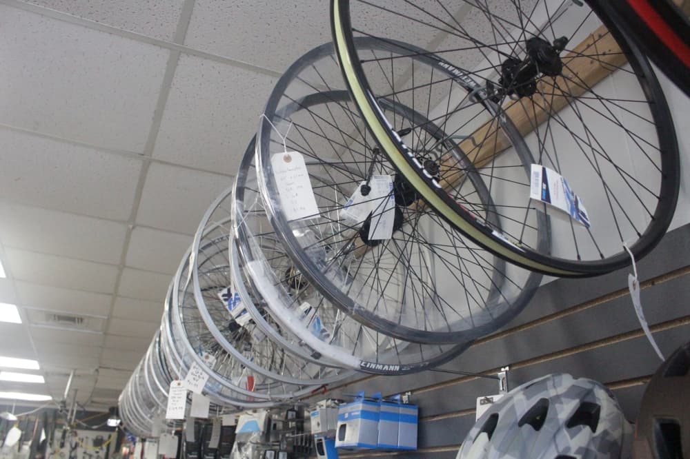 Bike tires hang on display in the store