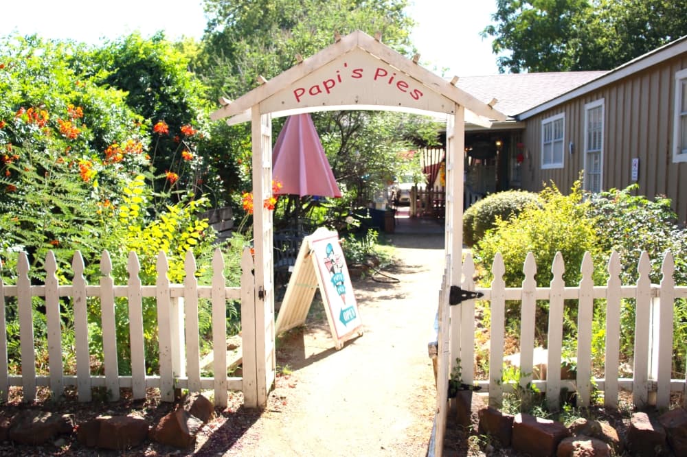 the exterior of a restaurant's outdoor dining space and garden