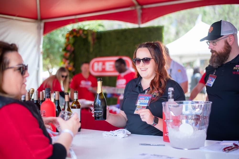 Girl serving wine at the festival