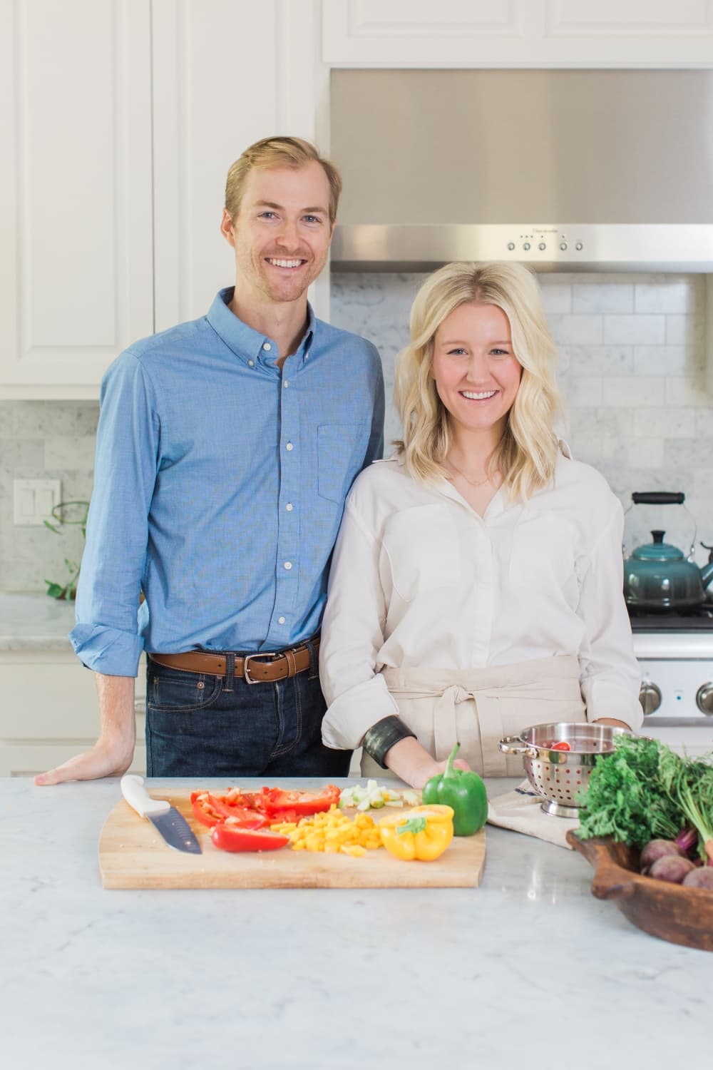 The founders of the restaurant pose for a photo in their kitche.