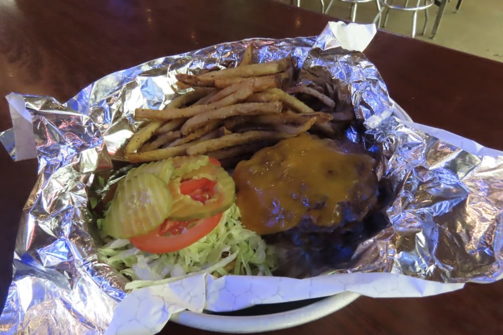 Serving of a cheeseburger at Katy Trail Icehouse in Dallas. 