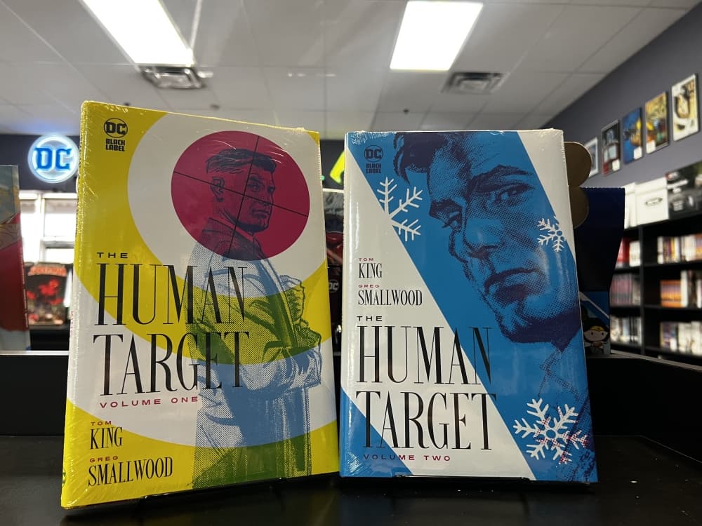 both of The Human Target comics on a shelf 