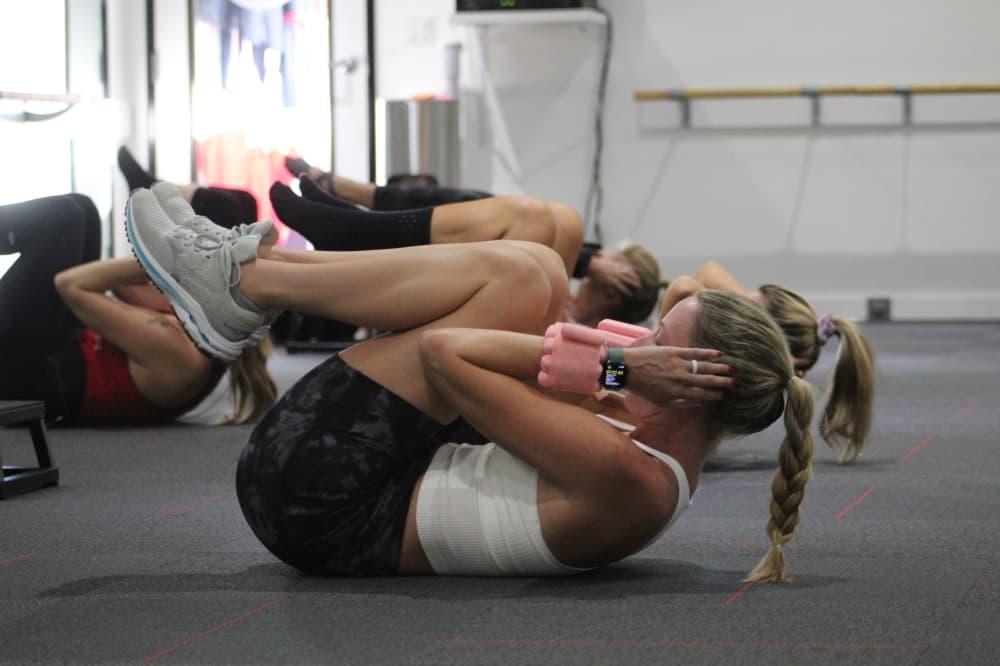 The Empower class uses light weight dumbbells to build strength. (Amira Van Leeuwen/Community Impact)
