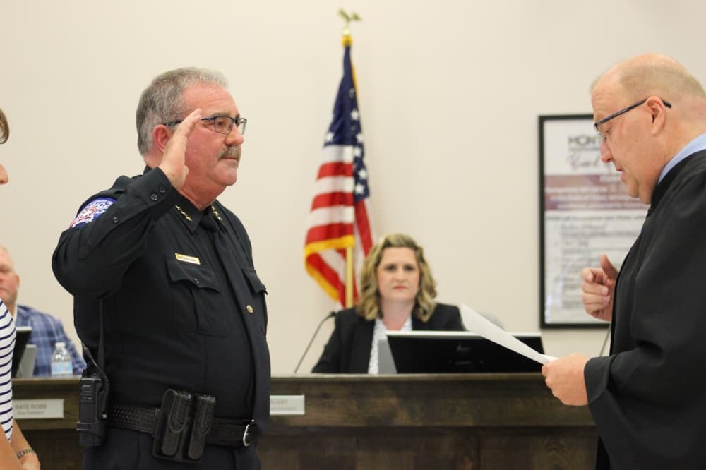 The photo shows Rickey Doerre being sworn in.