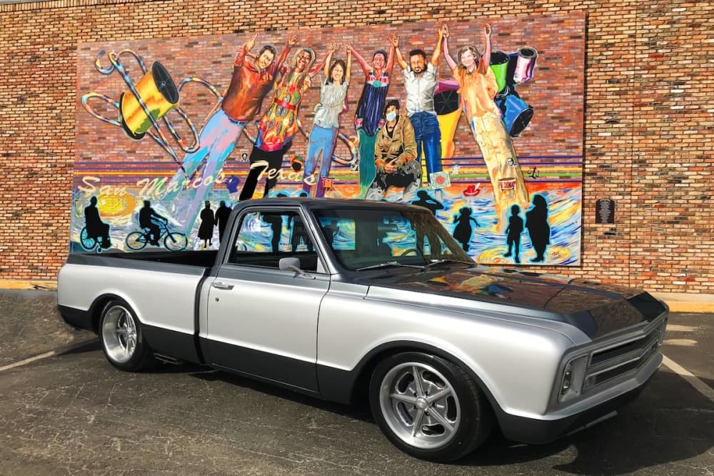 Truck in front of a mural